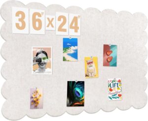 Scalloped cork board with pictures pinned on it.