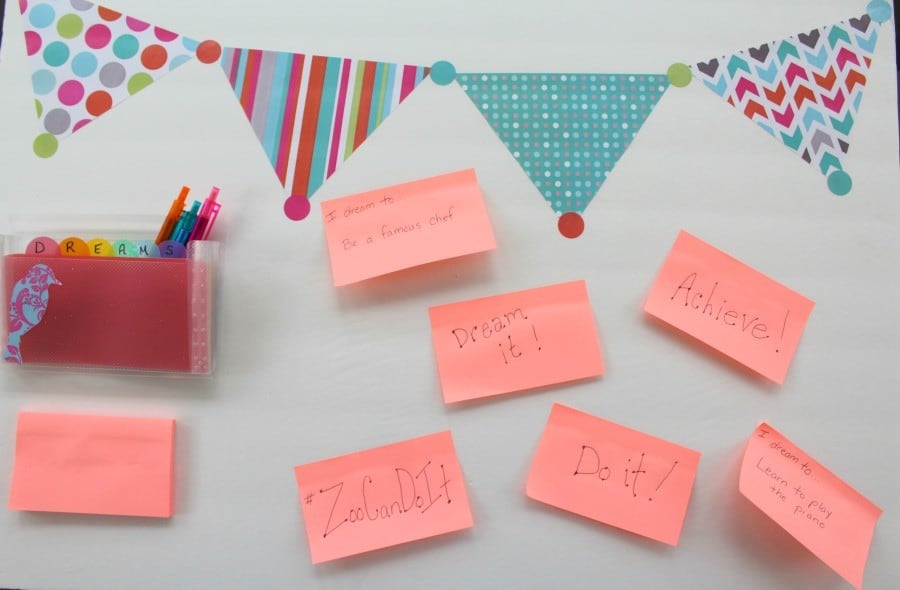 A Zootopia-themed vision board with a banner and pink sticky notes.