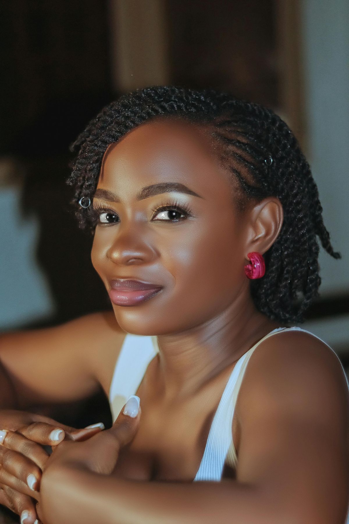 A black woman with natural hair twists.