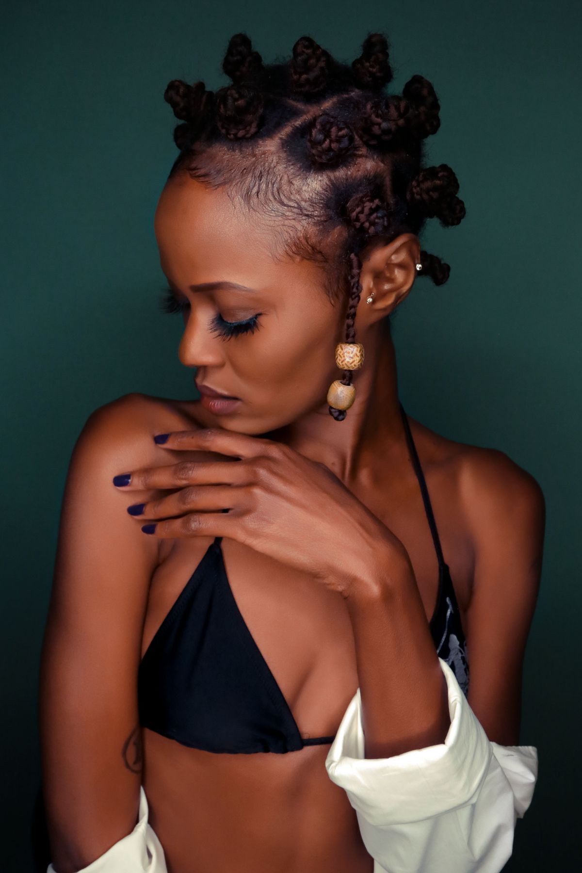 A black women with Bantu knots.