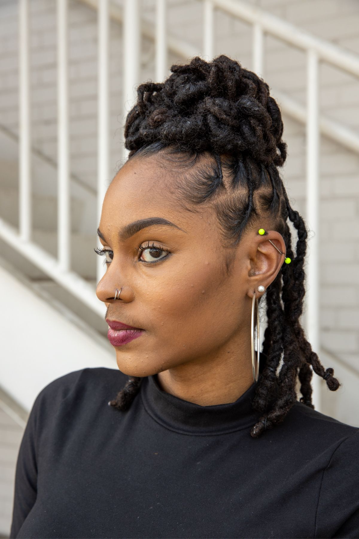 A black woman with faux locs.