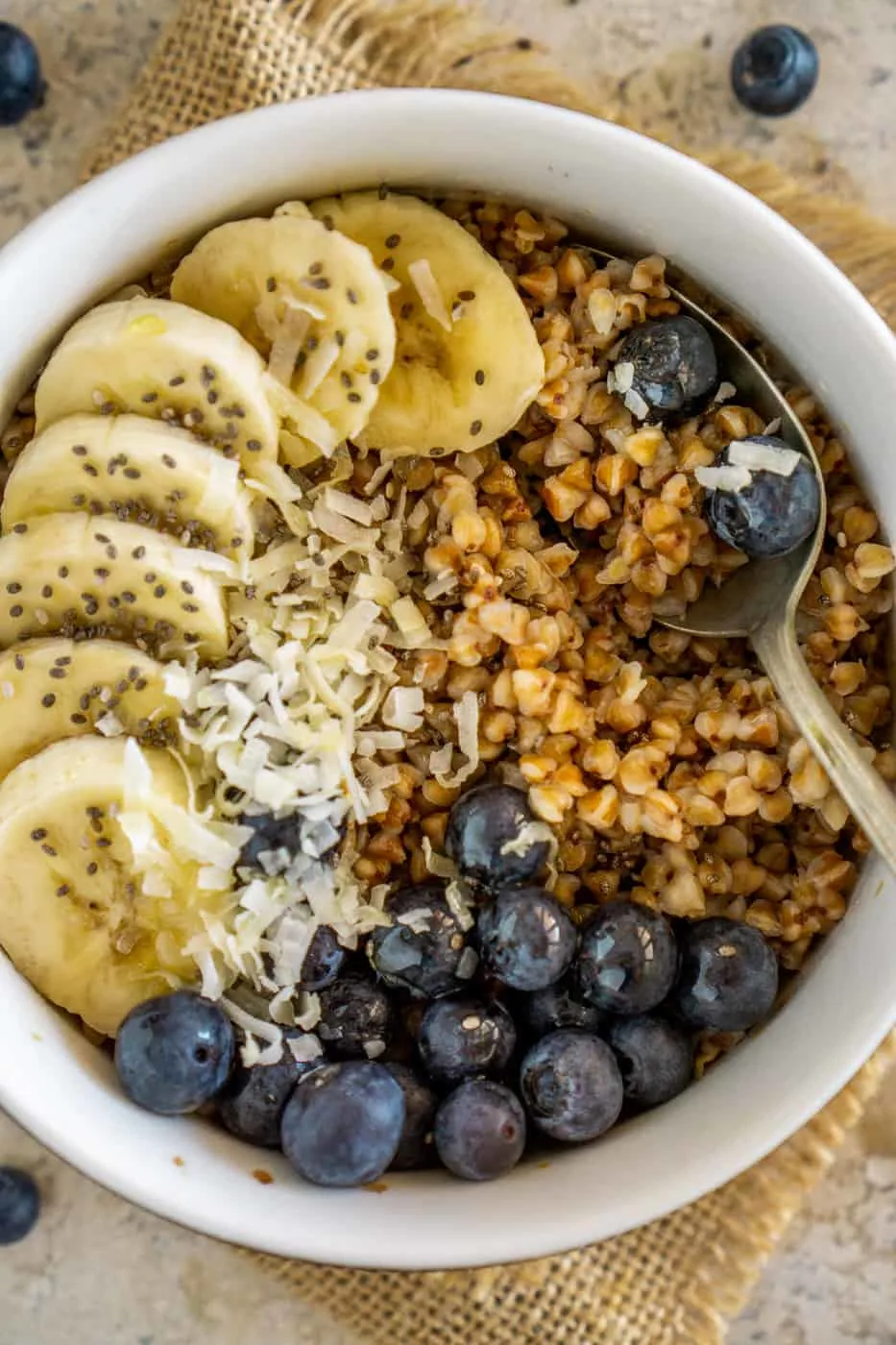 Buckwheat breakfast bowl with bananas and blueberries.