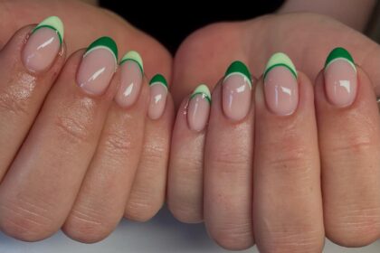 Almond French tip nails with light and dark green stripes.