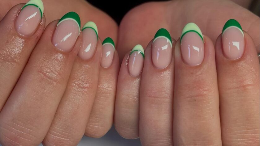 Almond French tip nails with light and dark green stripes.