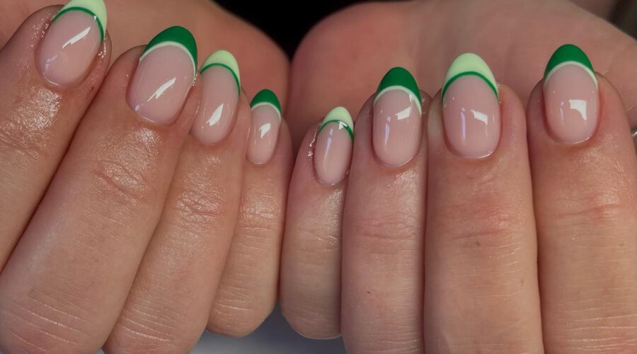 Almond French tip nails with light and dark green stripes.