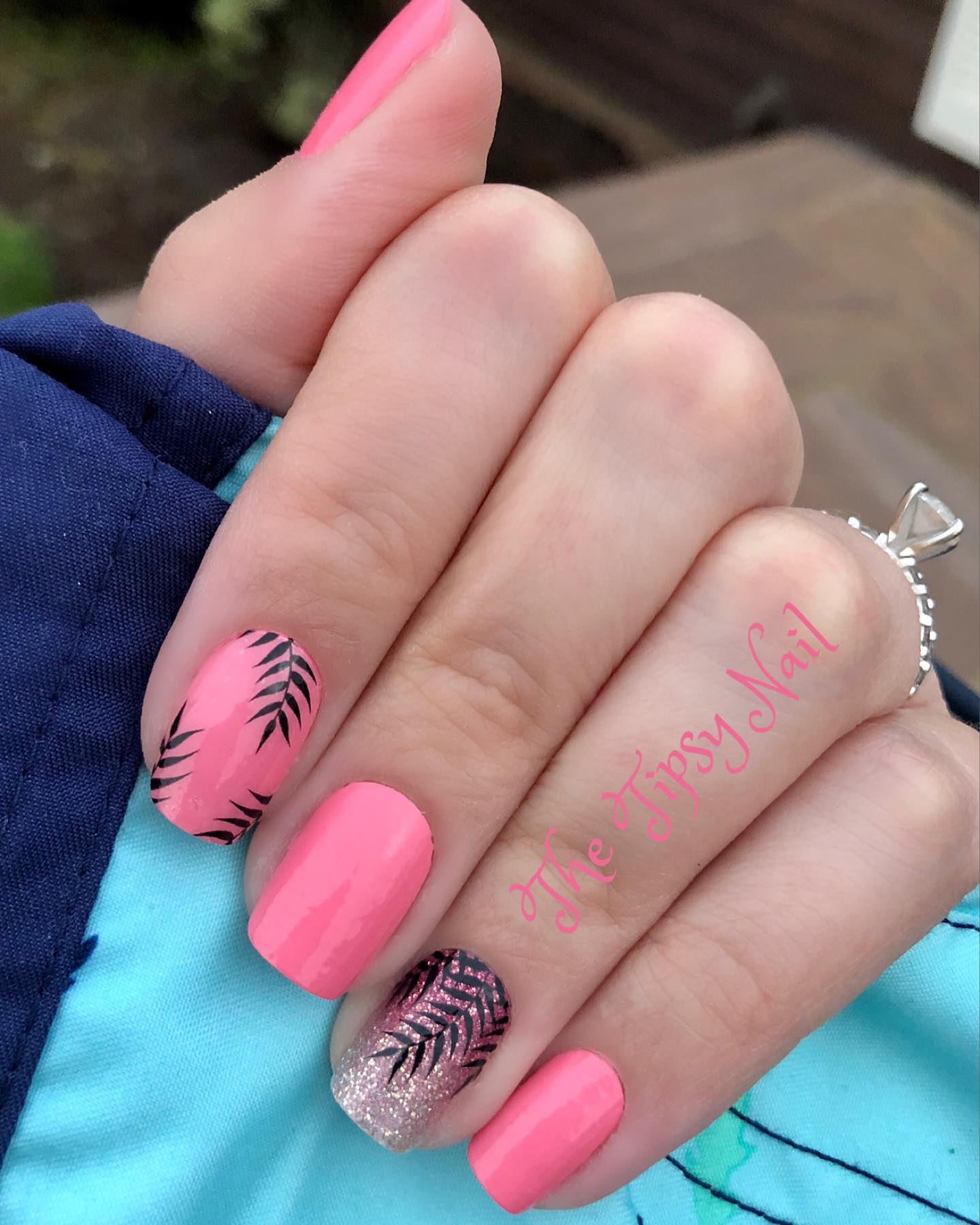 Pink nails with black palm fronds.