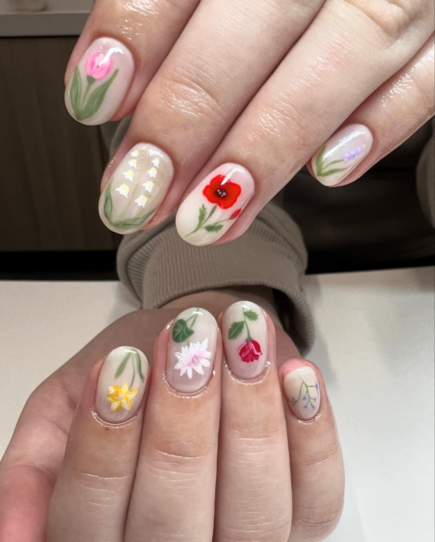 Painted nails with assorted floral nail art.