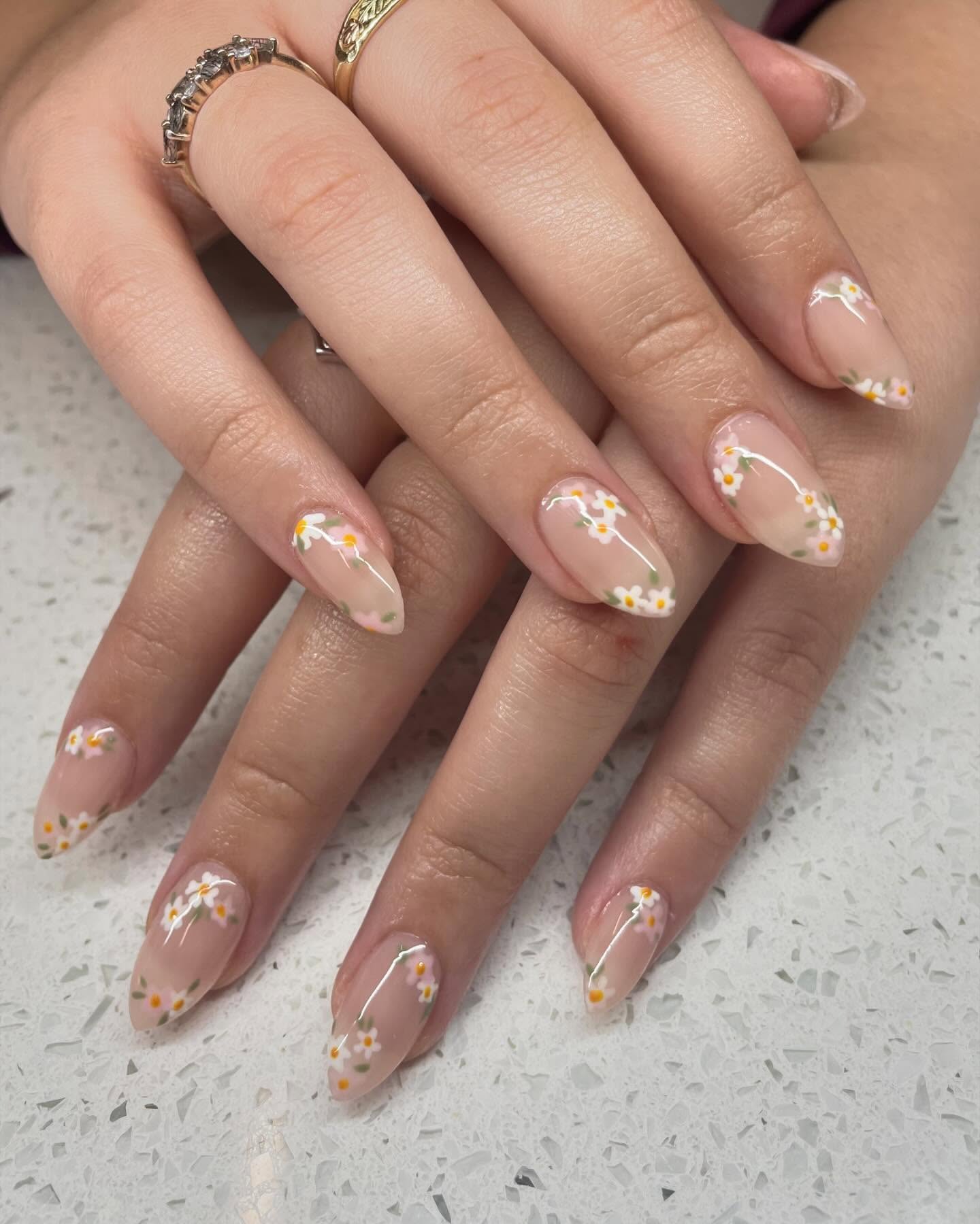 Nude almond nails with mini spring flowers.