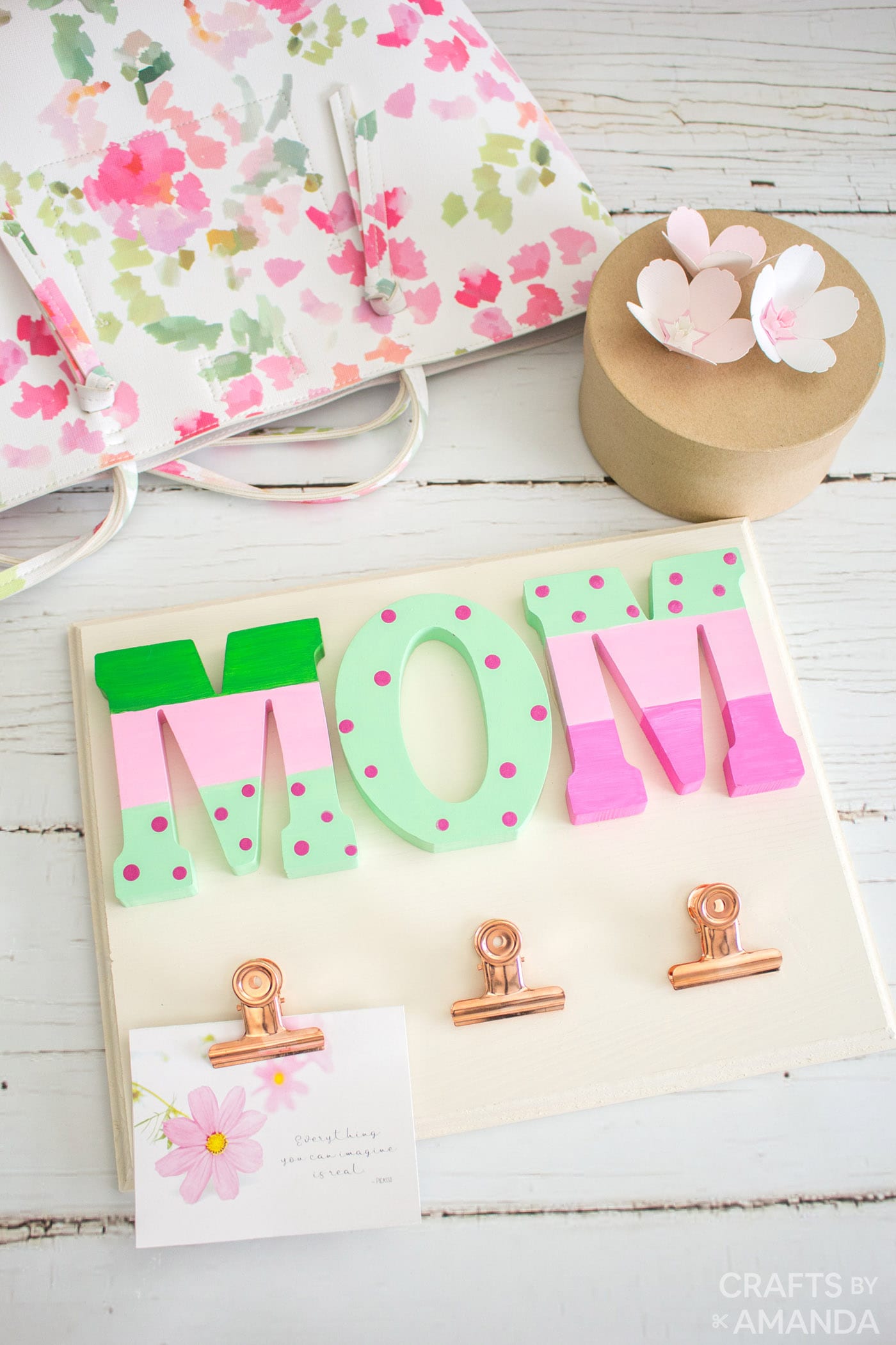 Mother's Day wall organizer craft on a white wood surface.